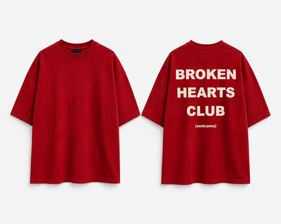 Red oversized tee, front and back. Back reads BROKEN HEARTS CLUB (welcome) in cream