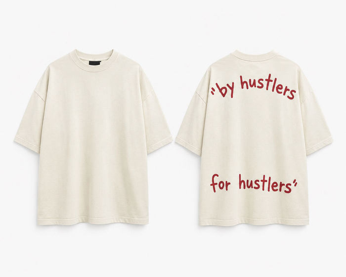 Cream oversized tee, front and back. Back reads by hustlers, for hustlers in red handwritten type
