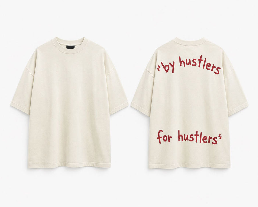 Cream oversized tee, front and back. Back reads by hustlers, for hustlers in red handwritten type