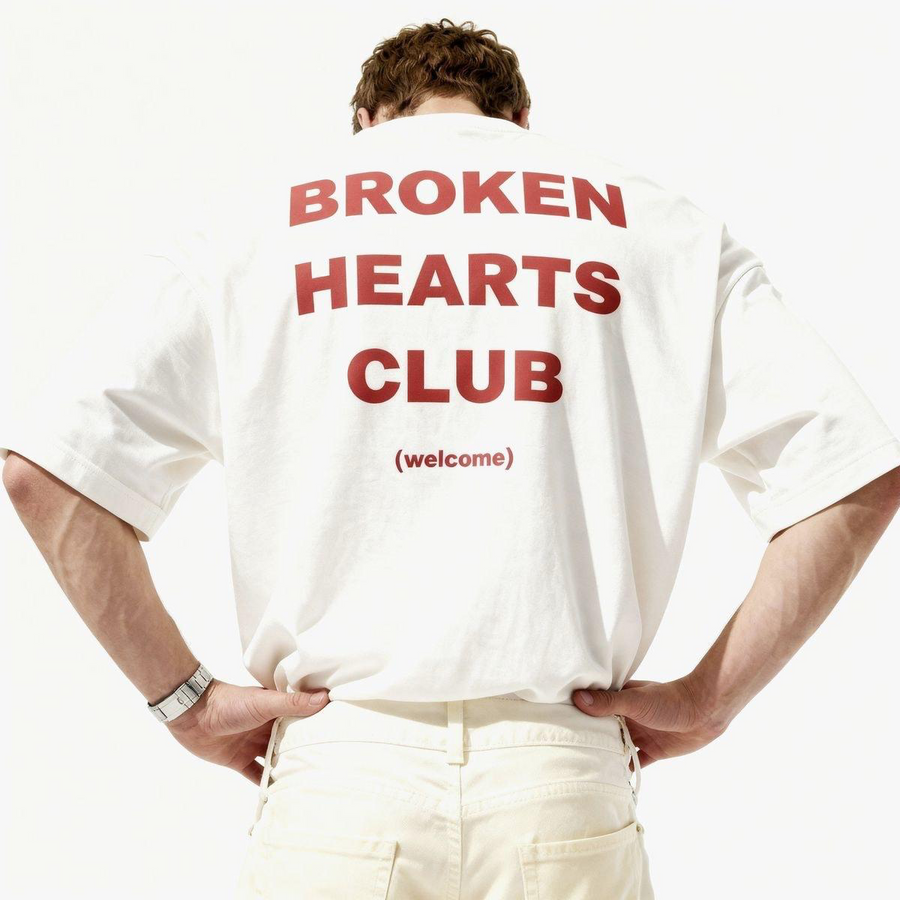Off white relaxed tee worn back to camera with red Broken Hearts Club type