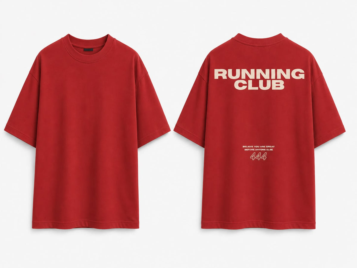 Red oversized tee, front and back. Back reads RUNNING CLUB with BELIEVE YOU ARE GREAT BEFORE ANYONE ELSE and 444 in cream