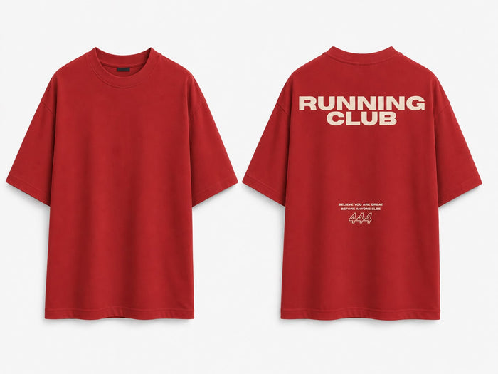 Red oversized tee, front and back. Back reads RUNNING CLUB with BELIEVE YOU ARE GREAT BEFORE ANYONE ELSE and 444 in cream