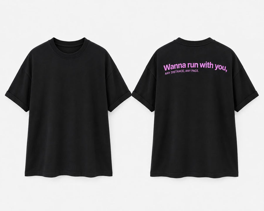 Black oversized tee, front and back. Back reads Wanna run with you, any distance, any pace in pink